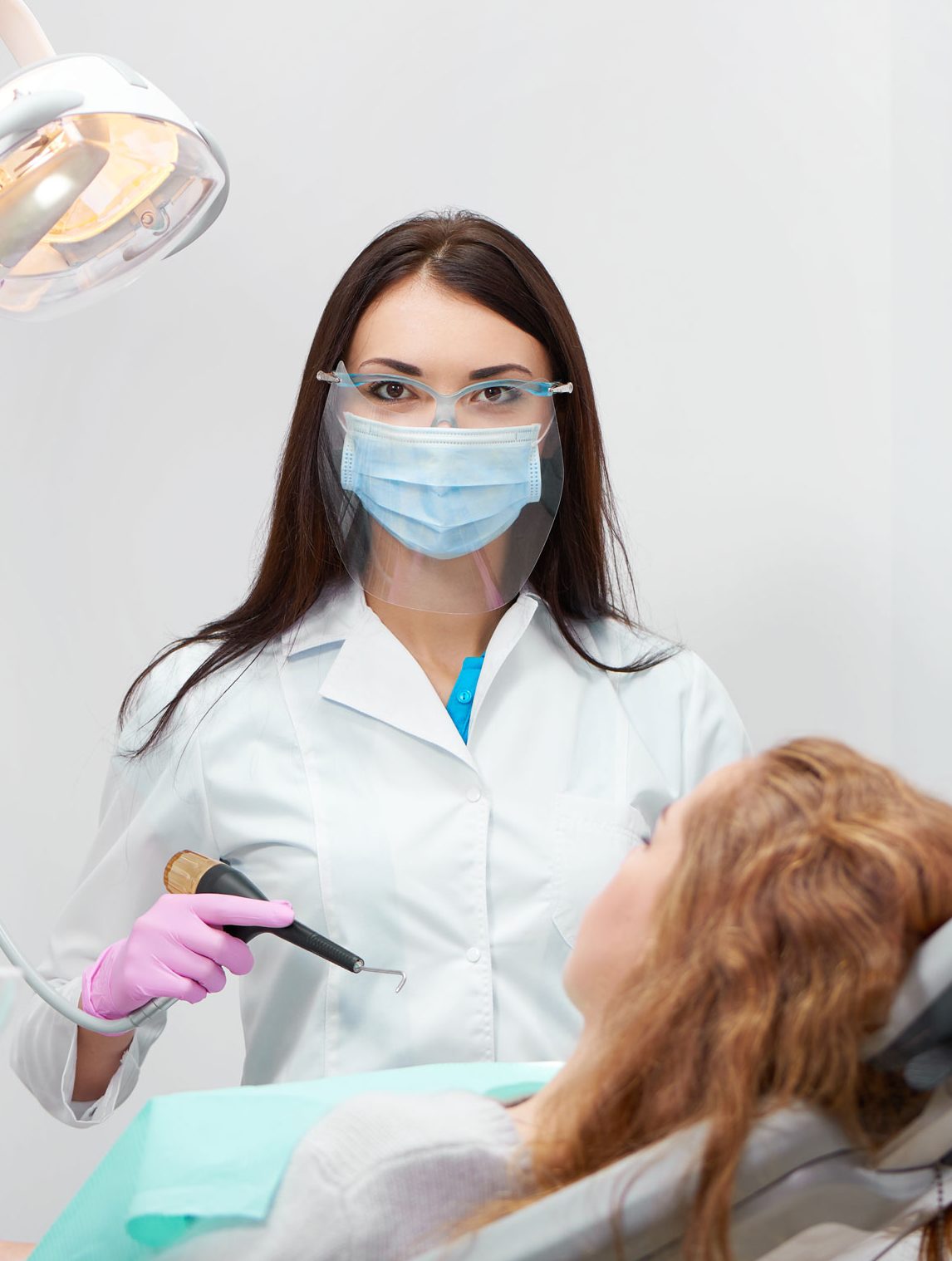 professional female dentist at work 9sdjlq4 e1616852692593.jpg
